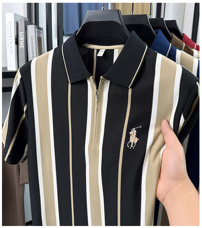 Black and cream striped polo showing contrast zip collar and embroidered chest motif