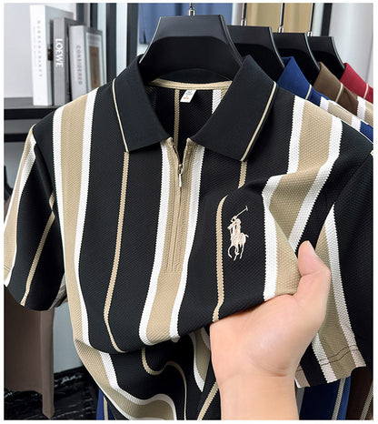 Close-up of black cream stripe short sleeve polo held to show fabric