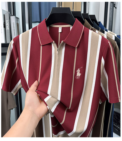 Close-up of wine maroon cream stripe polo held to show knit material